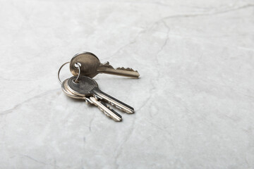House keys .Composition on gray marble background.Design element.Real estate and insurance concept.Copy space.