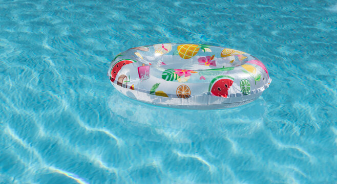 Hello summer concept with inflatable ring in the pool.