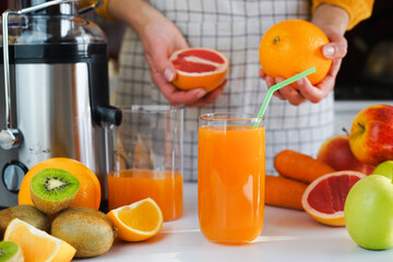 Healthy and delicious multivitamin fresh fruit juice in a glass on the table. Healthy food concept. Close-up. Selective focus.
