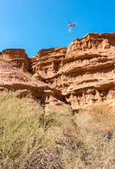 Red tales from clay. Issyk-Kul region in Kyrgyzstan. Beautiful mountain landscape. Tourism and...