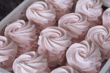 Homemade marshmallows are laid out on a tray. Homemade natural marshmallow. Close-up.