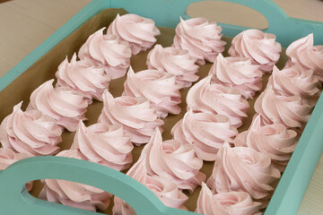 Homemade marshmallows are laid out on a tray. Homemade natural marshmallow. Close-up.