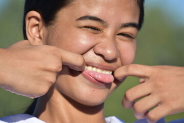 An Asian Female Teenager Funny Face