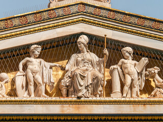 Detail of the gold plated east gable of the building of the University of Athens, Greece. Athena,...
