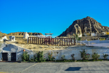 Obraz premium Guadix, Spain - 09 november 2019: The territory of the hotel with rooms in the rock