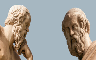Plato and Socrates, the ancient Greek philosophers, with thoughtful expressions. Marble statues, details.
