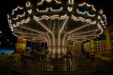 Photo children's carnival carousel with horses