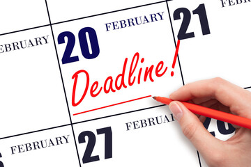 Hand drawing red line and writing the text Deadline on calendar date February 20. Deadline word written on calendar
