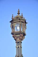 Fototapeta na wymiar Cadiz, Spain. Vintage lamppost on beautiful embankment on a sunny day.