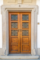 Fototapeta na wymiar Massive wooden door entrance brown classic big wood gate