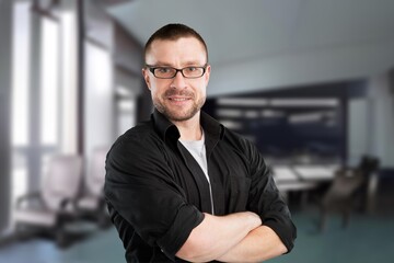 Fototapeta premium Happy mature male business leader standing at office window. Job success concept