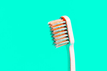 Toothbrush on mint green background,close up