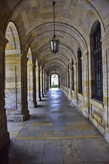 Obraz premium Stone arches at the building on the square near Cathedral of Santiago de Compostela
