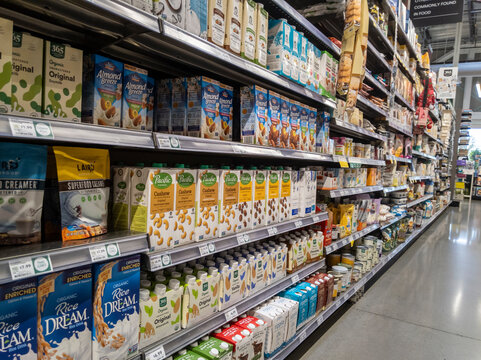 Kirkland, WA USA - circa September 2021: Angled, selective focus on shelf stable boxed milk alternatives inside a Whole Foods Market.