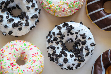 Donut with white glaze and black cookies