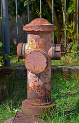 Old fire hydrant next to the sidewalk of a residential condominium, Rio