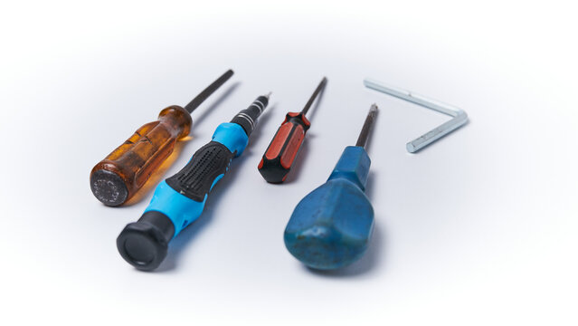 Several screwdrivers with their respective use, isolated