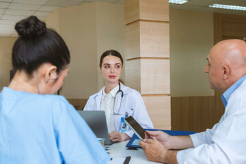 Obraz premium Team doctor, nurse and internship doctor talking and discussing about surgery treatment patient’s case while sitting in the meeting room office in hospital. healthcare and medical concept.