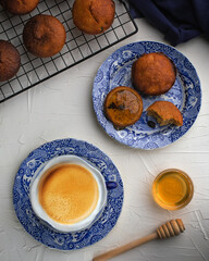 Muffins with raisins served with coffee and honey for restaurant on white background.Top view