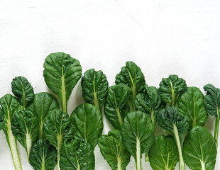 Vegetable, Delicious Fresh Green Bok Choy, Pok Choi or Pak Choi on White Table. copy space