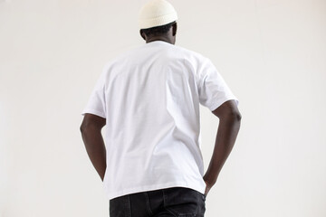 Back view of a man in a white t-shirt. Mock-up.