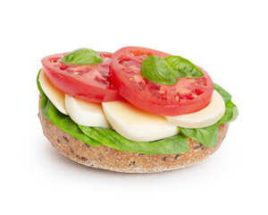 whole grain bread sandwich with mozzarella, tomatoes and basil on a white isolated background