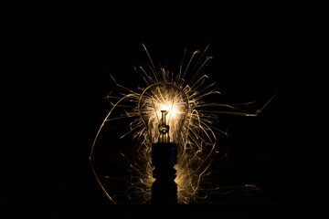The incandescent lamp burns with sparks