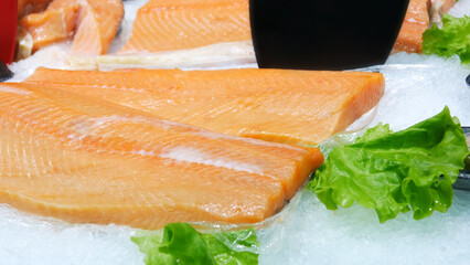 Close-up of a beautiful fish fillet on an ice display case