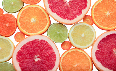 Top view of slices of citrus fruit isolated on white background. Studio shot