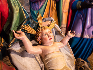 Feldkirch, Austria - January 21, 2022: The Christmas figure of the newborn Jesus in the manger