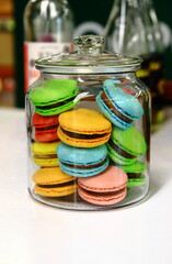 French macaroons, colorful cookies on the table. Dessert for coffee.