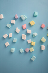 marshmallows gummy on blue surface sweet food
