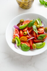 Close up of  of tomatoes salad in white bowl