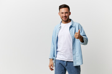 Cheerful happy tanned handsome man in casual basic t-shirt show thumb up gesture Like posing isolated on over white studio background. Copy space Banner Mockup. Lifestyle People emotions concept