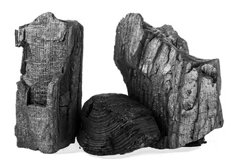 Pile of natural hardwood charcoal isolated on a white background. Wood charcoal or traditional charcoal.