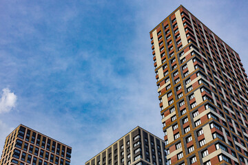 Obraz premium Moscow high apartment building against the blue sky