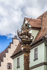 Fototapeta na wymiar Rothenburg ob der Tauber, Germany. Sculpture decorating the Georgsbrunnen fountain