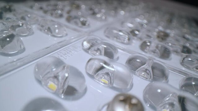 Light emitting diodes in powerful led lamp in dark studio extreme close view. Details of modern illumination equipment
