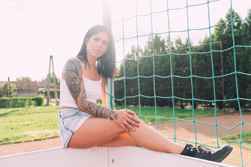Young tattooed woman summer portrait - 509242552