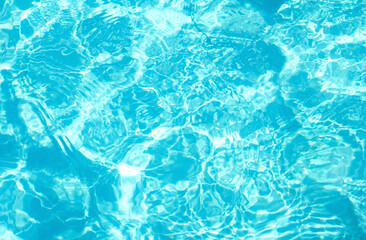 Surface of blue transparent water in the pool