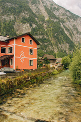 Photography of houses by the river in Hallstatt Austria