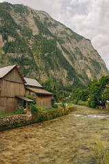 Photography of houses by the river in Hallstatt Austria