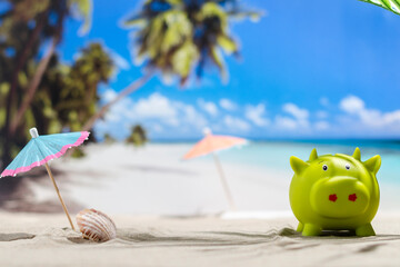 Obraz premium Piggy bank on sunny beach