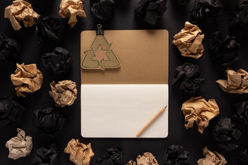 Notepad or notebook and crumpled paper balls at background texture. Inspiration creative idea - 509245584