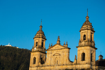 Bolivar square church and the sanctuary of Monserrate in the background, at Bogota, Colombia.