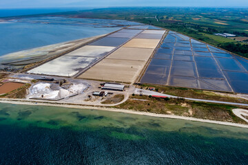 Aerial view of salt evaporation ponds and salt mounds