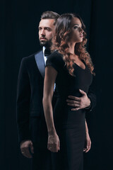 photo of young family couple on black background.