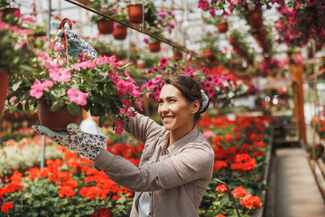 Fototapeta premium Florists Women Working With Flowers In A Greenhouse