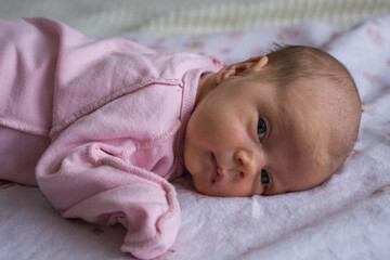 Portrait of caucasian cute little infant girl. healthy one month baby