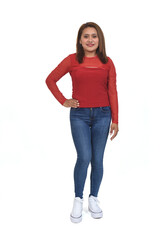 front view of a full portrait of a women with jeans and sneaker looking at camera and hand on hip over white background